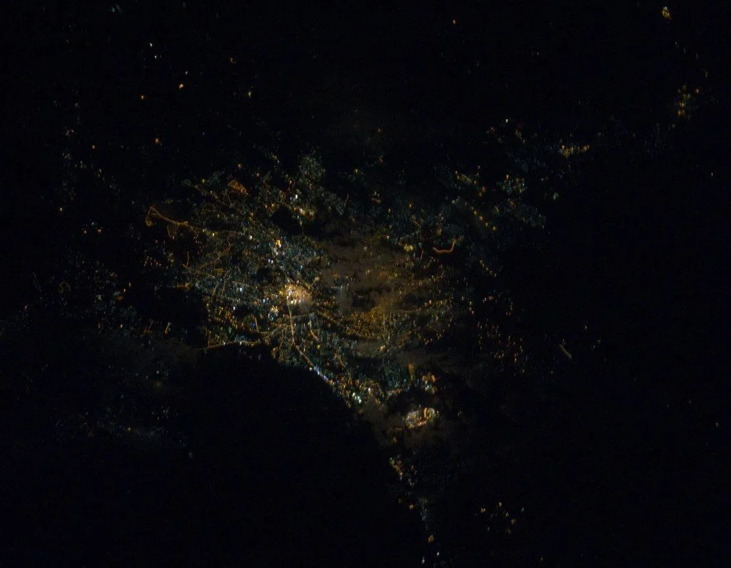 Nairobi at night as seen from the International Space Station, with the city centre glowing at the middle of a web of lit streets