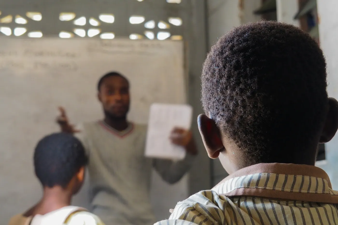 A trainer teaching a class of attentive students in a bright classroom
